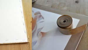 Stretch your watercolor paper and fix it on the board using some tape or staple it.