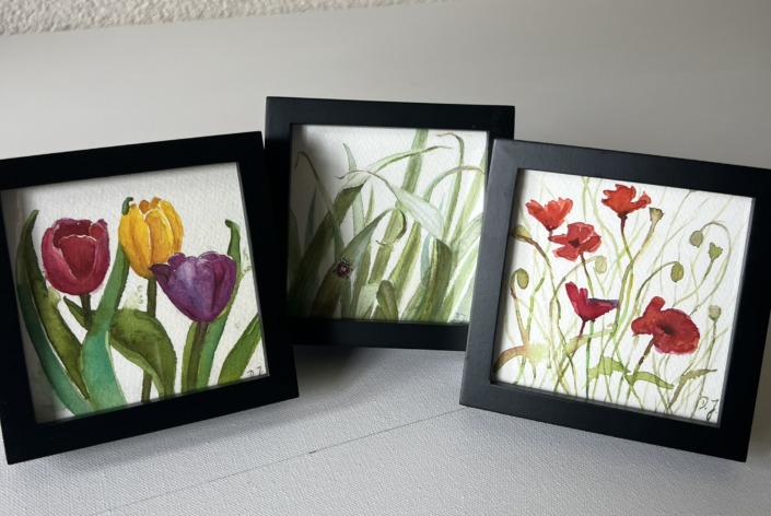 framed small watercolor paintings, little floral poems, black frame